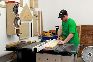 working on a cabinet table saw