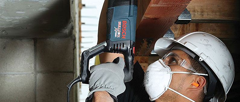 A Man Wearing Safety Goggles While Using Bosch 11255VSR