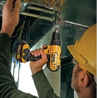 A worker using a DCD771 Drill/Driver